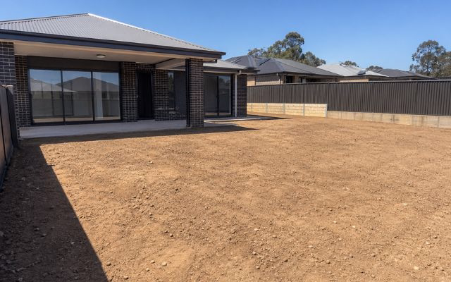 Bare dirt backyard at a new residential build in South East Queensland ready for hydroseeding or hydromulching lawn installation